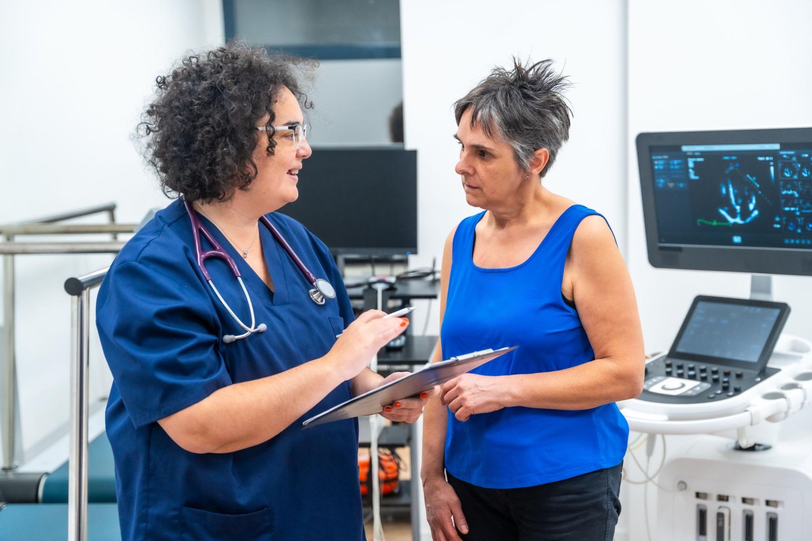 Cardiologist reviewing echocardiogram results with patient in Houston